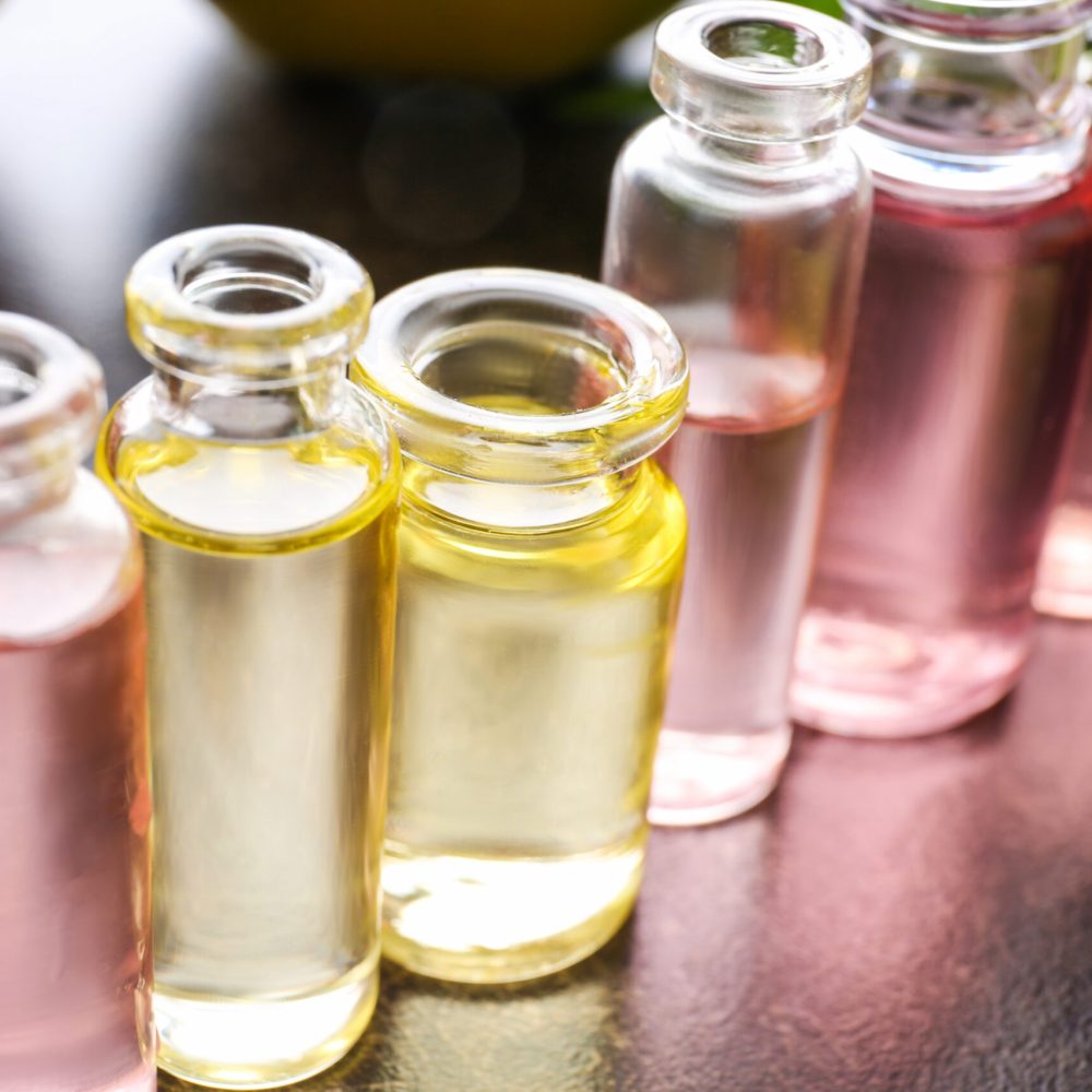 Perfume bottles on table, closeup